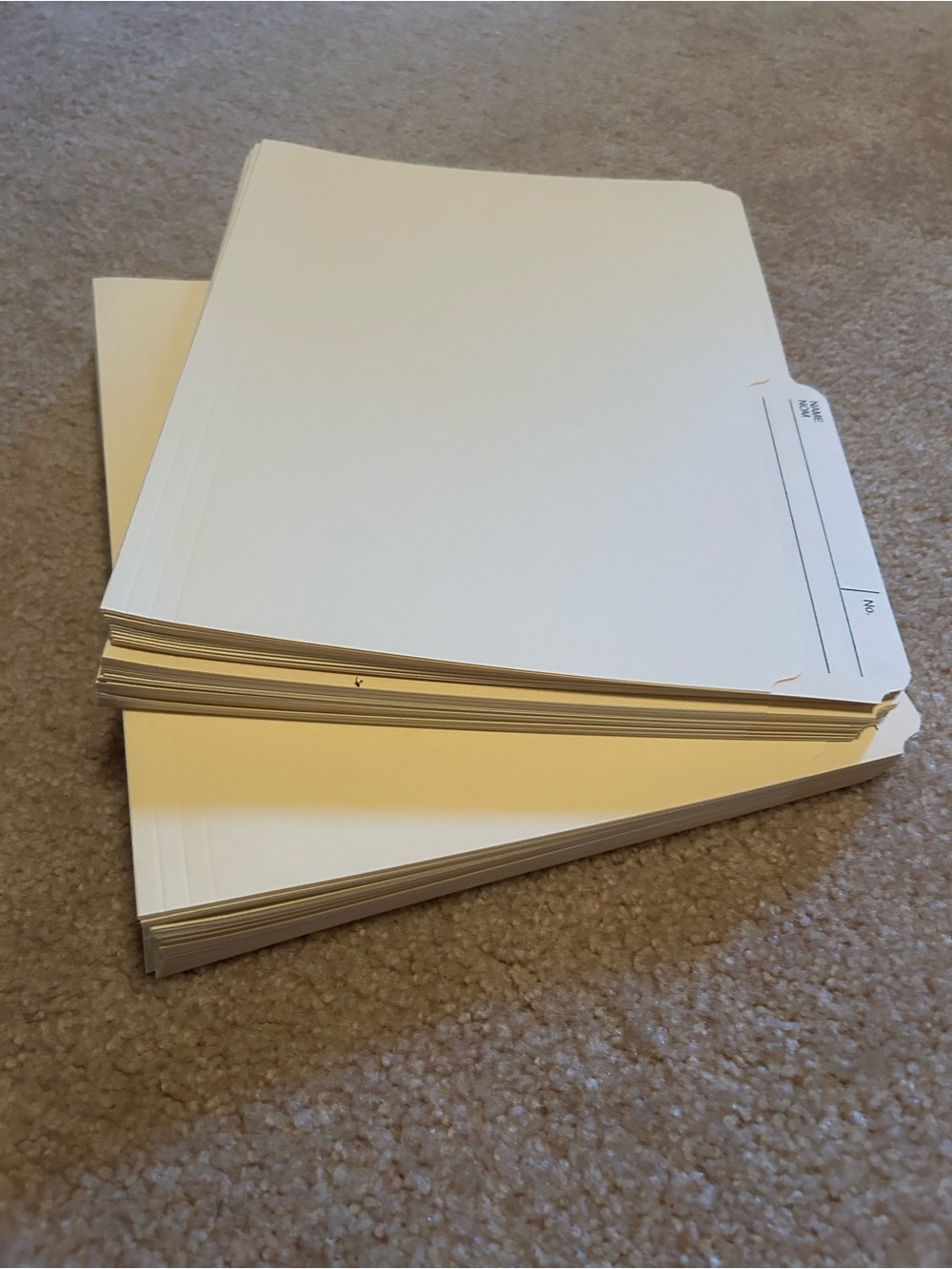 Stack of Cream Colour File Folders - Tabbed